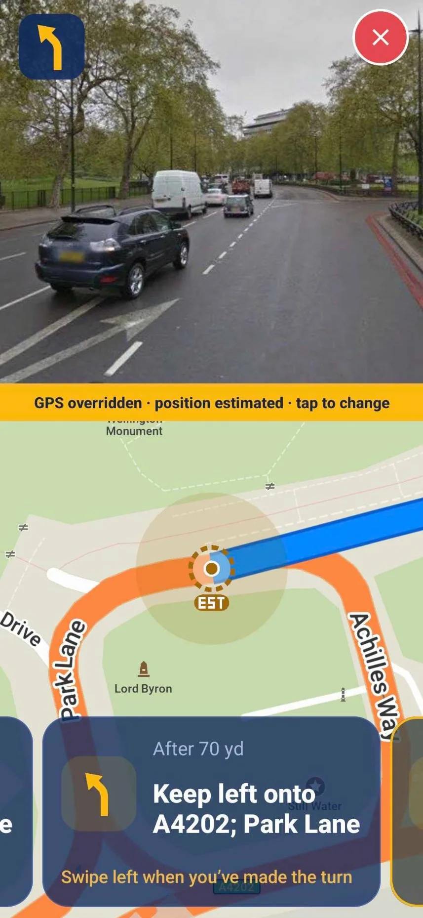 Assisted navigation in Blue Light Maps approaching Hyde Park Corner: a photo of the junction as it looks on approach, the route on the map, and the next instruction in large type, 'Keep left onto A4202; Park Lane'