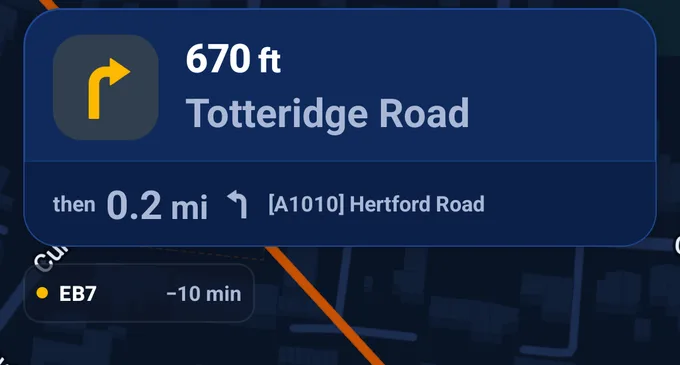 Navigation view with the next turn at the top and an attending unit chip below it: callsign EB7, en route, arriving ten minutes ahead