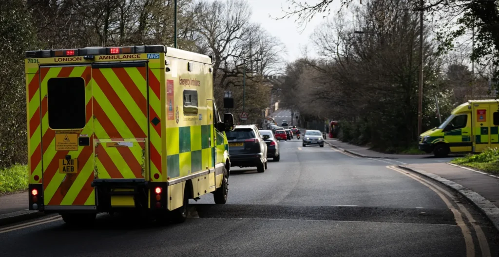 Photo of ambulance driving over speed hump